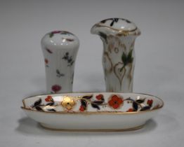 Two Continental porcelain Meissen style handles, early 20th century, the first painted with