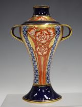 A Macintyre Moorcroft two-handled vase, circa 1900, of baluster shape with red flowers against a