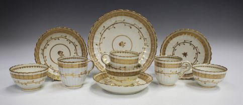 Three Caughley porcelain trios, circa 1790, of fluted form gilt with an undulating foliate band