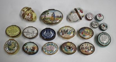 Eighteen Halcyon Days enamel boxes, including two egg shaped examples, four Christmas boxes and four
