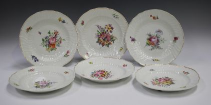 A set of six porcelain dinner plates, 19th century, probably Meissen, outside decorated with