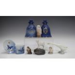 Four Royal Copenhagen models, comprising kid goat on rocks, owl, otter and mermaid, together with