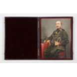 PHOTOGRAPH. A leather-cased hand-coloured photograph of an officer, possibly the Middlesex Regiment,
