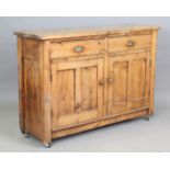 A late Victorian pine kitchen cabinet, fitted with brass handles, height 98cm, width 145cm, depth
