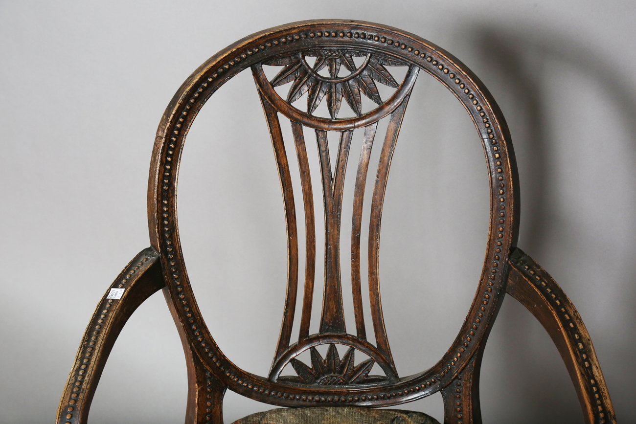A late George III Neoclassical walnut framed elbow chair with a beaded frame and caned seat, - Image 11 of 11