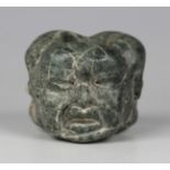 A pre-Columbian Olmec style carved green hardstone bead, possibly 900-450 BC, finely modelled with