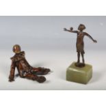 An early 20th century German cast bronze Art Deco figure depicting a young lady balancing a ball,