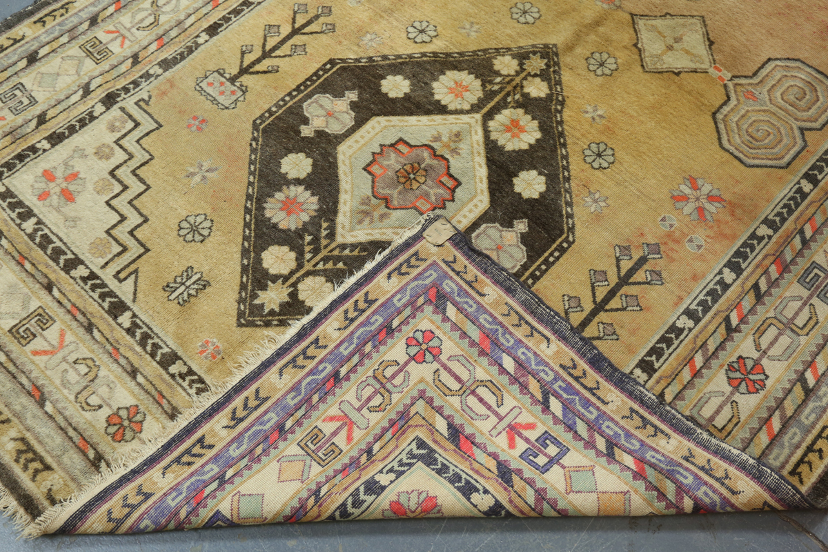 A South-west Persian rug, mid-20th century, the faded yellow field with two lozenge medallions, - Image 2 of 11