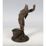 A late 19th century French brown patinated cast bronze figure of a blindfolded ex-military