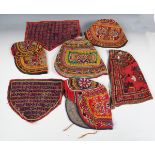 A group of three Indian Kutch embroidered bodices, one with inset mirror work, length 53cm, a