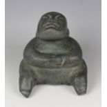A pre-Columbian Olmec style carved green hardstone figure, possibly 900-450 BC, modelled as a seated