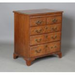 An early 20th century George I style burr walnut bachelor's chest with feather and crossbanded