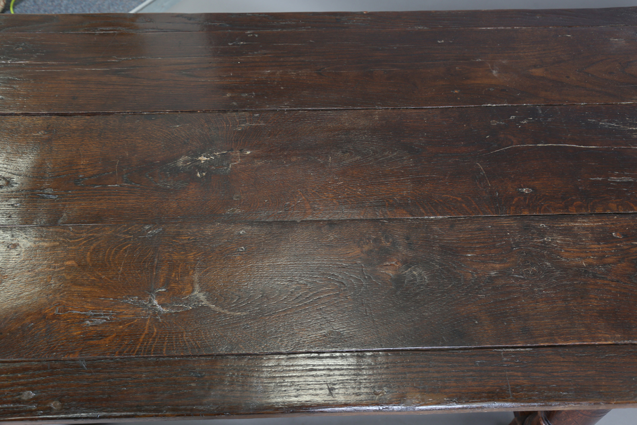 A 17th century style oak refectory table, raised on turned and block legs, height 73cm, length - Image 7 of 8