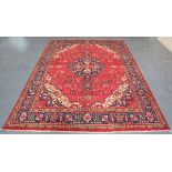 A Tabriz carpet, Central Persia, mid/late 20th century, the red field with an angular medallion,