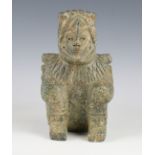 A pre-Columbian style carved green hardstone eagle warrior figure, possibly Aztec civilization,