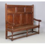 A George III provincial oak panel back hall bench with solid panel seat, height 145cm, width