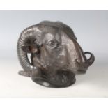 A 20th century brown patinated cast bronze wall mount in the form of a ram's head, height 13.5cm.