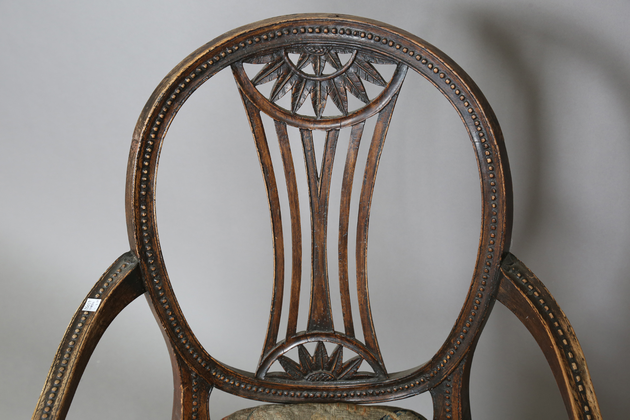 A late George III Neoclassical walnut framed elbow chair with a beaded frame and caned seat, - Image 10 of 11