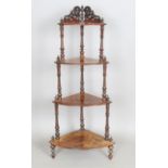 A Victorian walnut four-tier graduated corner whatnot, height 123cm, width 53cm.Buyer’s Premium 29.