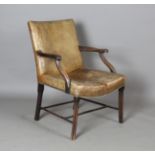 An early 20th century George III style mahogany framed Gainsborough armchair, upholstered in tan