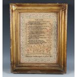 A fine George IV needlework sampler by Elizabeth Treble, aged 10 years, dated 1826, the central