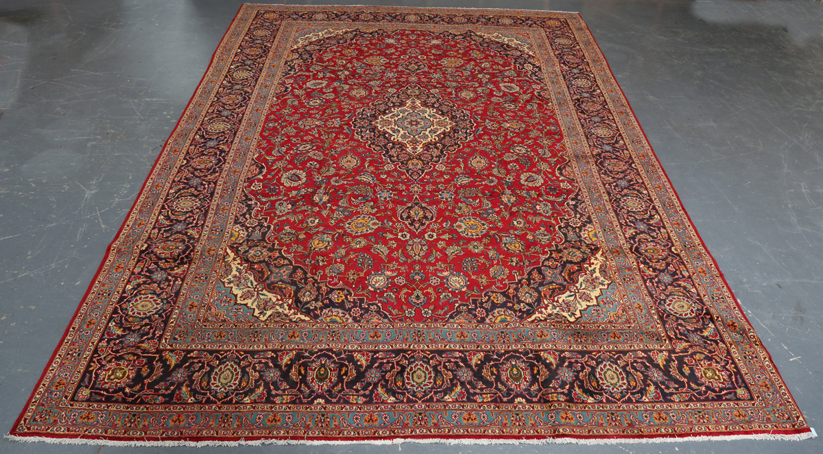 A Kashan carpet, Central Persia, mid/late 20th century, the red field with a shaped medallion,