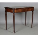 A fine George IV figured mahogany fold-over tea table, in the manner of Gillows of Lancaster, the