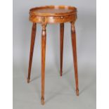 A George III satinwood kettle stand, in the manner of Mayhew & Ince, the galleried oval top above