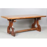 An 18th/19th century Continental walnut refectory table, the thick rectangular top on a pair of