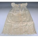 A group of late Victorian and Edwardian infants' gowns, including an embroidered white linen dress