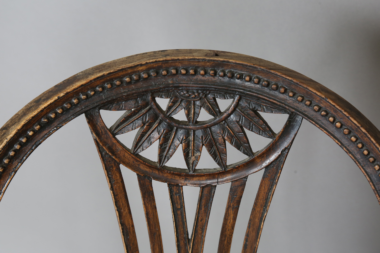 A late George III Neoclassical walnut framed elbow chair with a beaded frame and caned seat, - Image 9 of 11