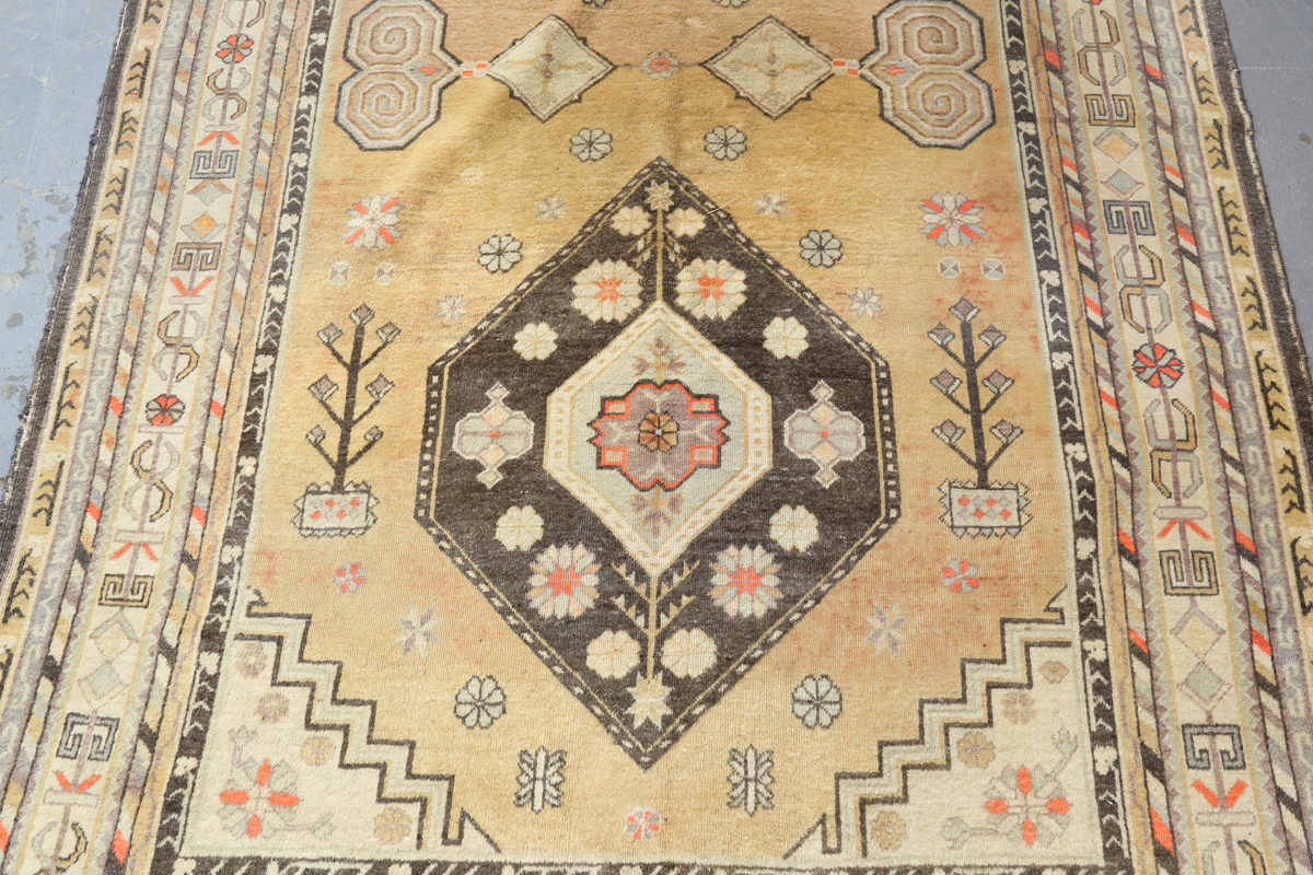 A South-west Persian rug, mid-20th century, the faded yellow field with two lozenge medallions, - Image 5 of 11