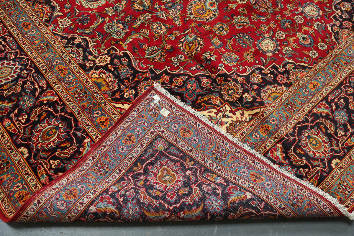 A Kashan carpet, Central Persia, mid/late 20th century, the red field with a shaped medallion, - Image 2 of 5