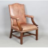 A late 20th century George III style mahogany framed library armchair, upholstered in buttoned