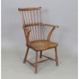 A 19th century primitive beech and elm stick back Windsor armchair, height 86cm, width 60cm, depth