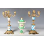 A pair of late 19th century gilt metal and porcelain mounted three-light candelabra, height 36.