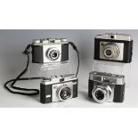 A small collection of various cameras and accessories, including a Voigtländer Perkeo I camera, a