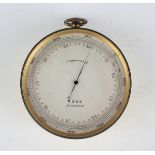 An early 20th century gilt brass circular cased travelling barometer altimeter, the silvered dial