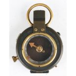 A First World War period oxidized brass cased pocket compass, detailed 'No. 71752' and dated '1917',