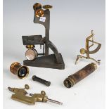 A small group of scientific instruments, including an Abney level and clinometer by Winter & Son,