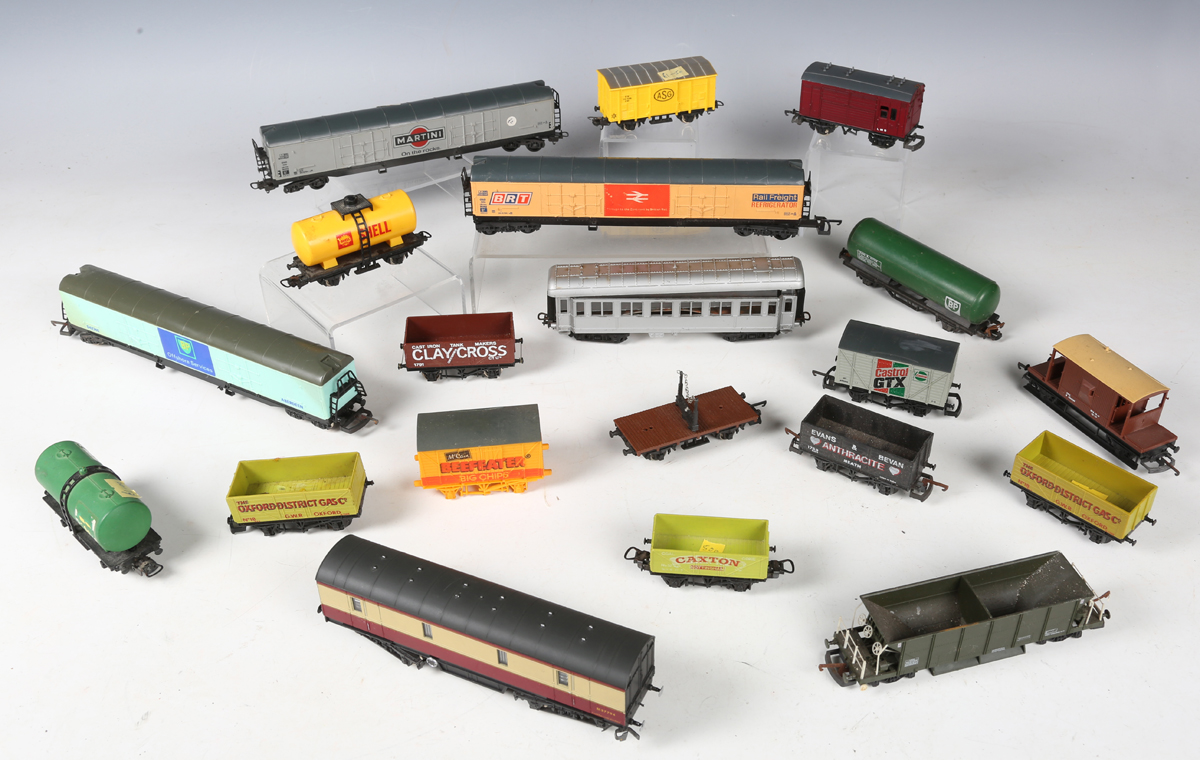 A good collection of Lima gauge OO coaches and goods rolling stock in various liveries, some