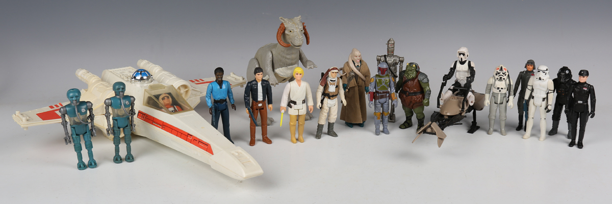 A collection of Star Wars figures and accessories, including Kenner X-Wing, Speeder Bike,