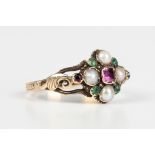 A Victorian gold, emerald, ruby and half-pearl cluster ring, decorated with scroll pierced