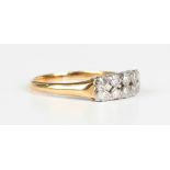 A gold, platinum and diamond ring, mounted with two rows of five circular cut diamonds, indistinct