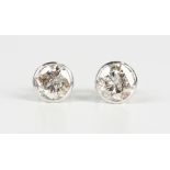 A pair of platinum and diamond single stone earstuds, each collet set with a circular cut diamond,