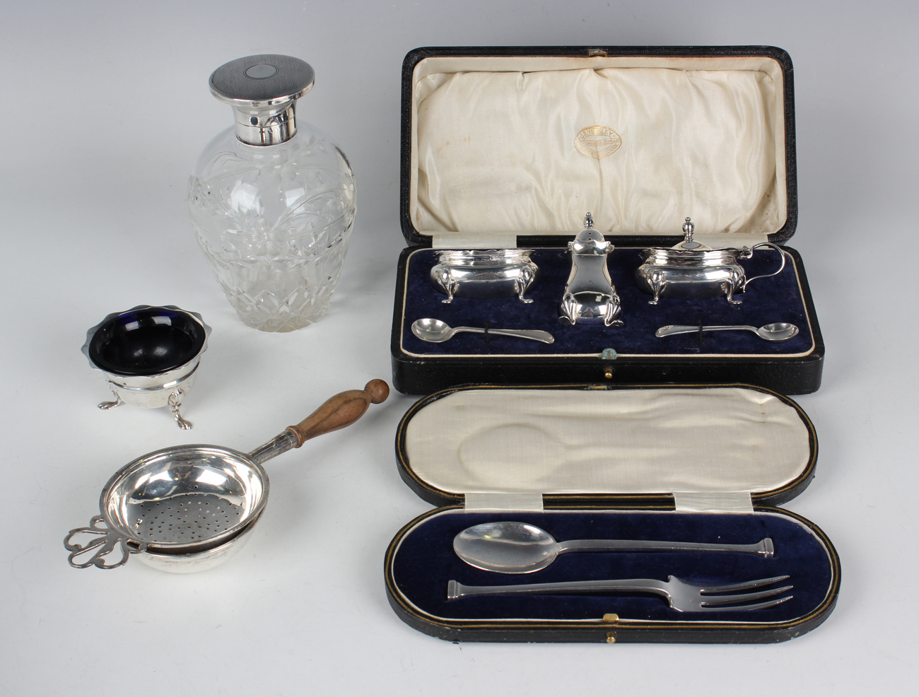 A George V silver three-piece condiment set, Birmingham 1923 by Adie Brothers Ltd, cased, together