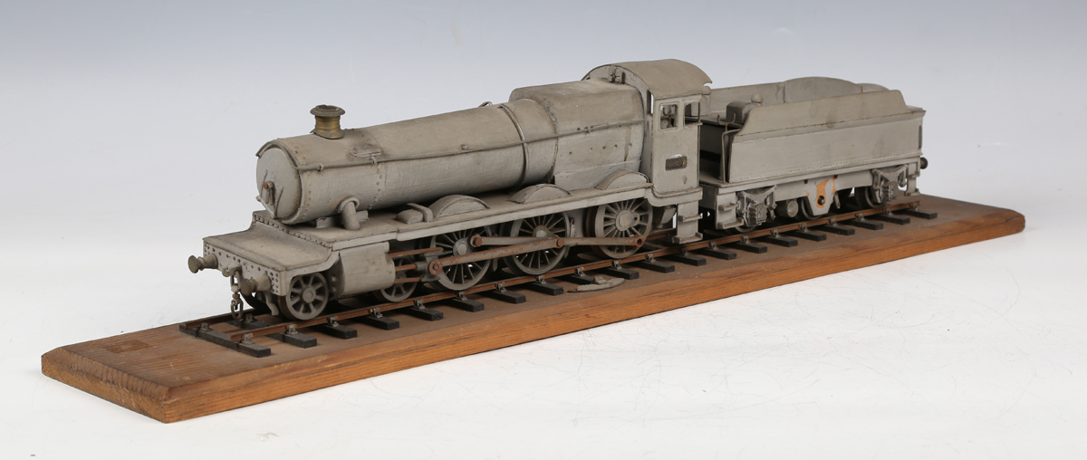 A wooden gauge O model of a 4-6-0 steam locomotive 6807 'Hewell Grange' and tender in WD grey