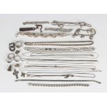 A group of mostly silver jewellery, comprising a charm bracelet, six further bracelets, a