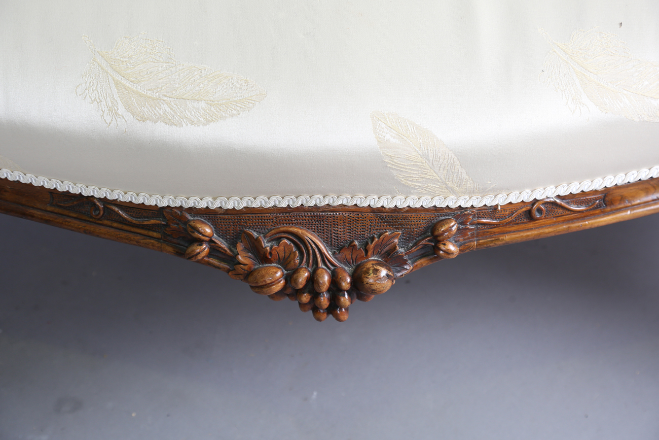 A fine mid-Victorian walnut showframe salon settee, the frame carved with flowers, leaves and fruit, - Image 2 of 11