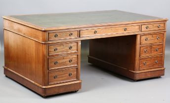 A mid-Victorian mahogany partners desk, the top inset with gilt-tooled green leather above an